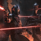 The Mandalorian and IG-11 sustaining heavy fire in the midst of battle.
